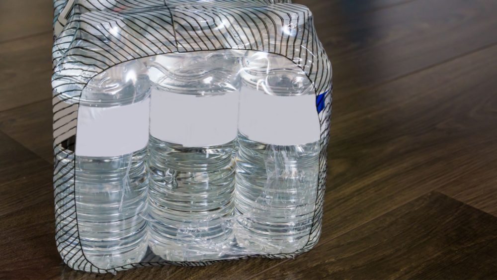 A package with water bottles wrapped in plastic